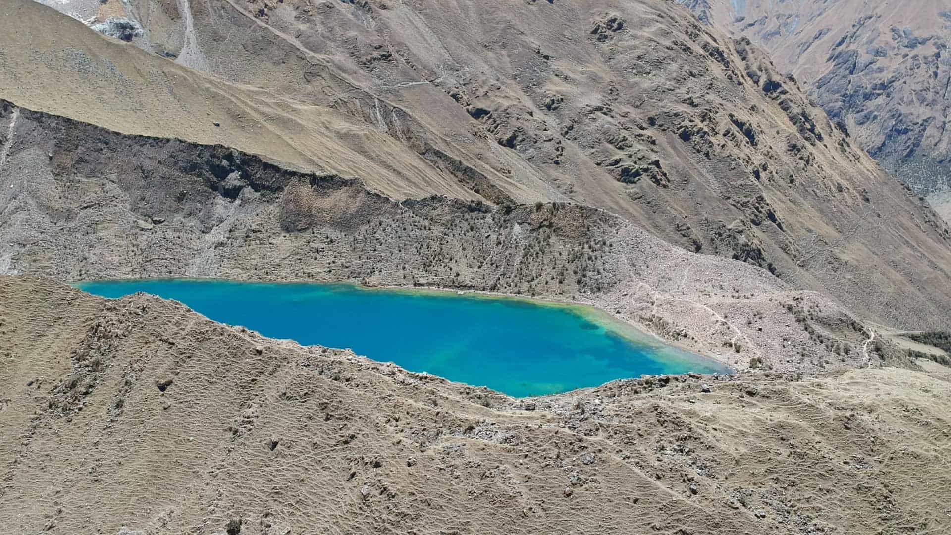 Turquoise water of Humantay Lake beneath the Humantay glacier
