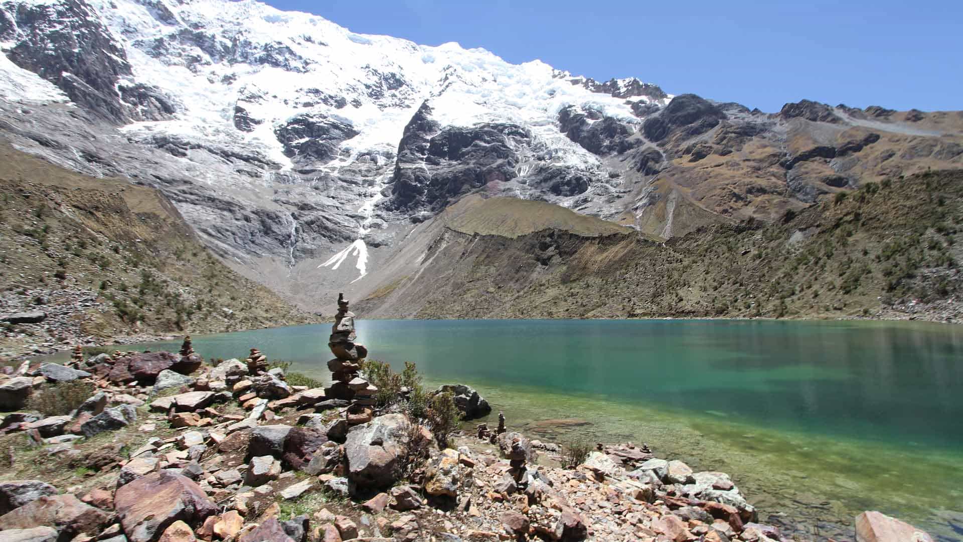 Turquoise glacial lake below the Salkantay glacier on the classic 5-day trek